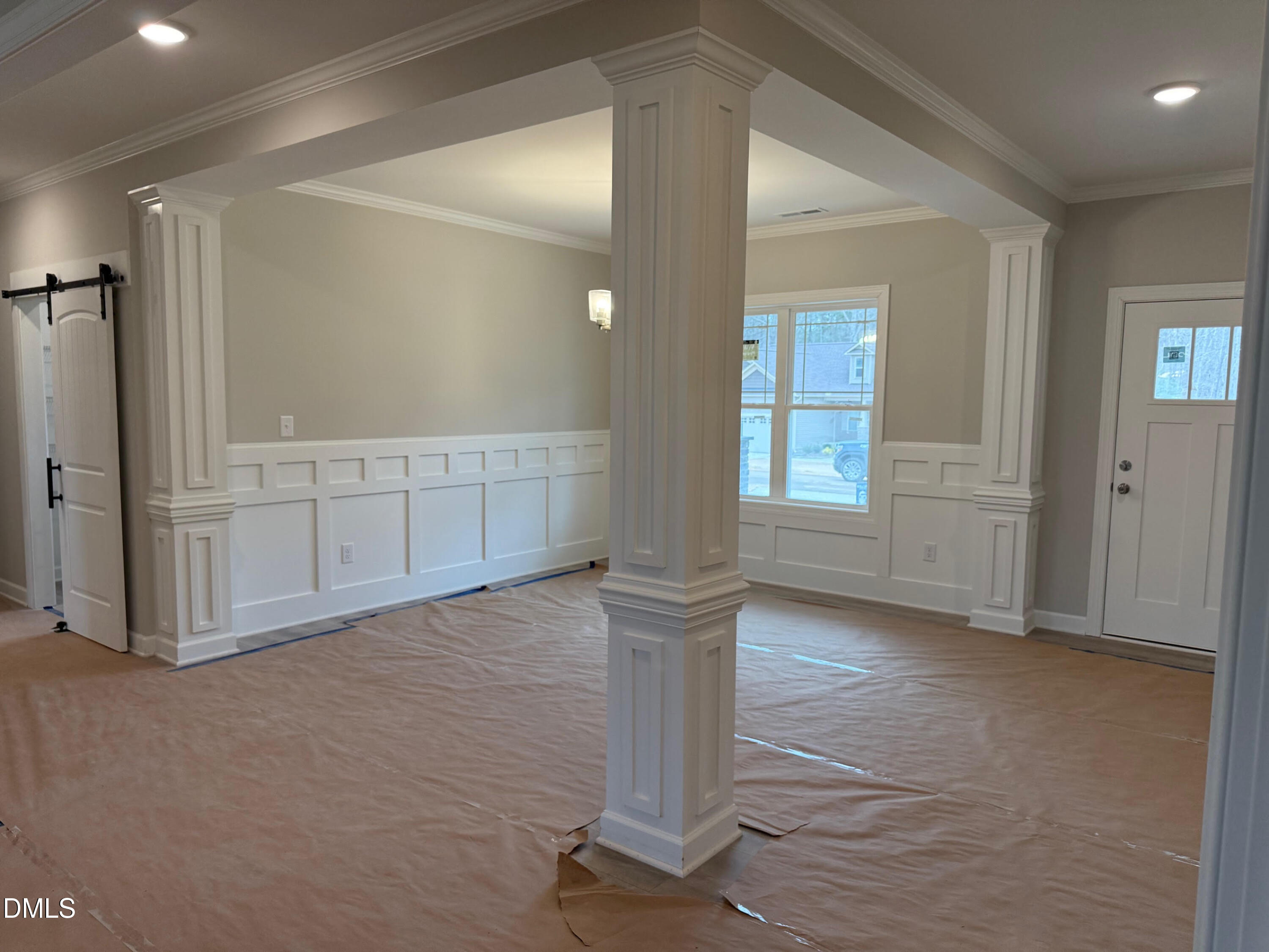 191 Seahawk Way Zebulon, NC 27597 - Photo 12 of 21 an empty room with wooden floor and cabinet