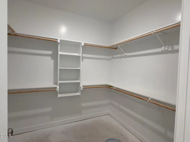 a empty closet with white paint