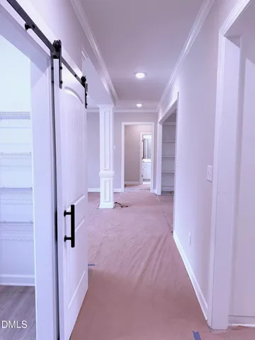 a view of a hallway with a livingroom