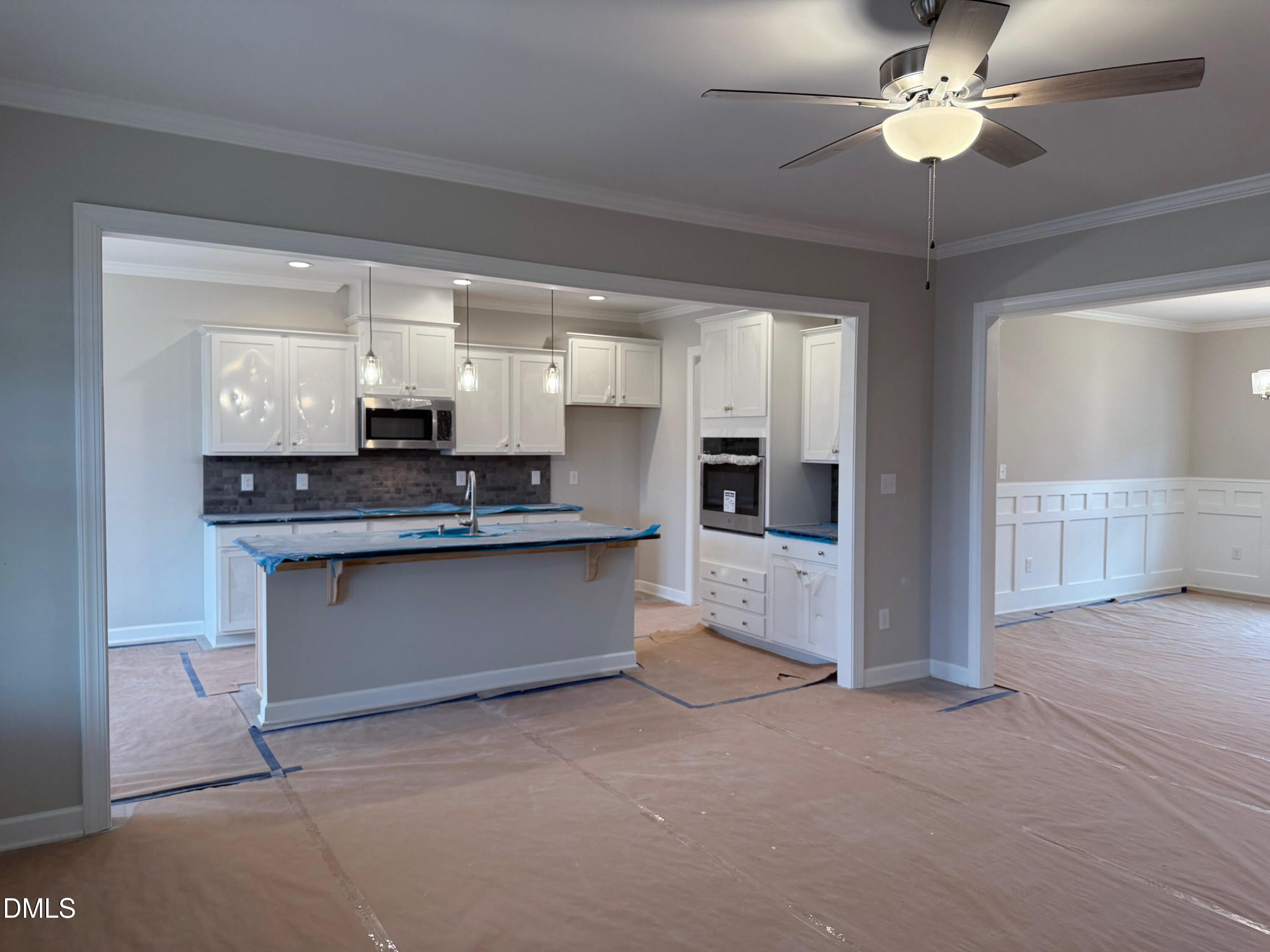 191 Seahawk Way Zebulon, NC 27597 - Photo 8 of 21 a view of kitchen with refrigerator and microwave