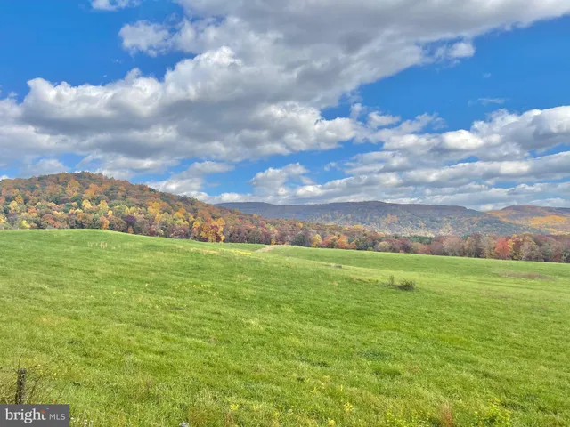 a view of a street with houses on both side