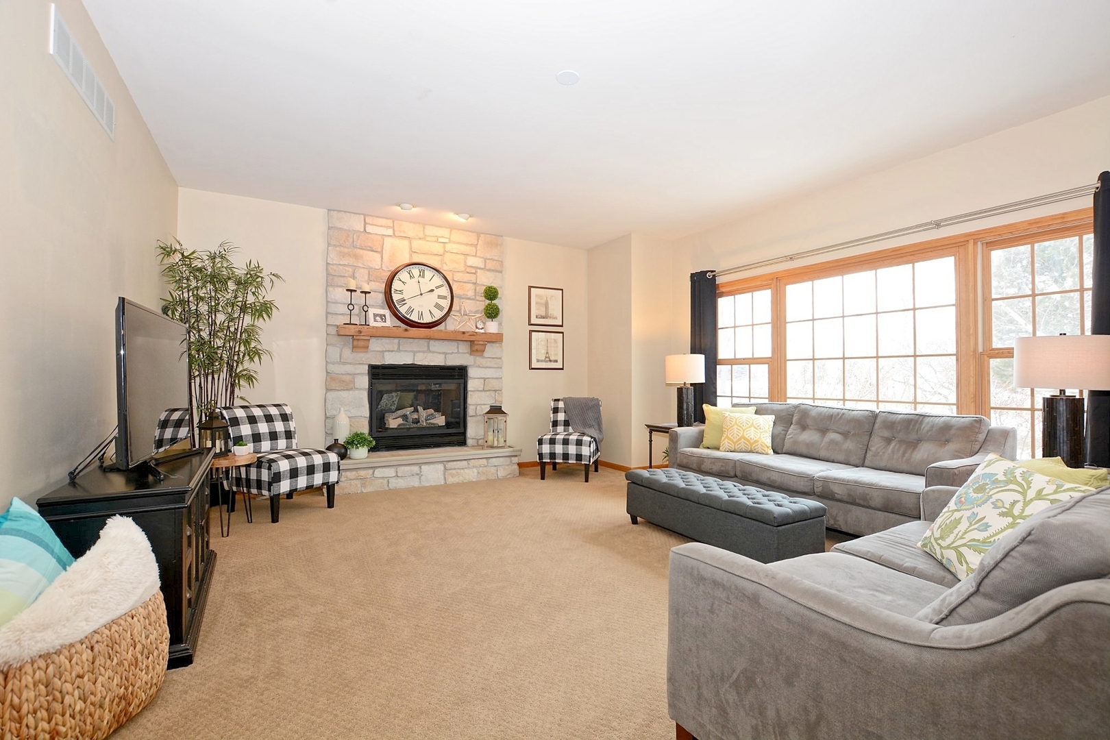 916 Merrill New Road Sugar Grove, IL 60554 - Photo 11 of 23 a living room with furniture a fireplace and a large window