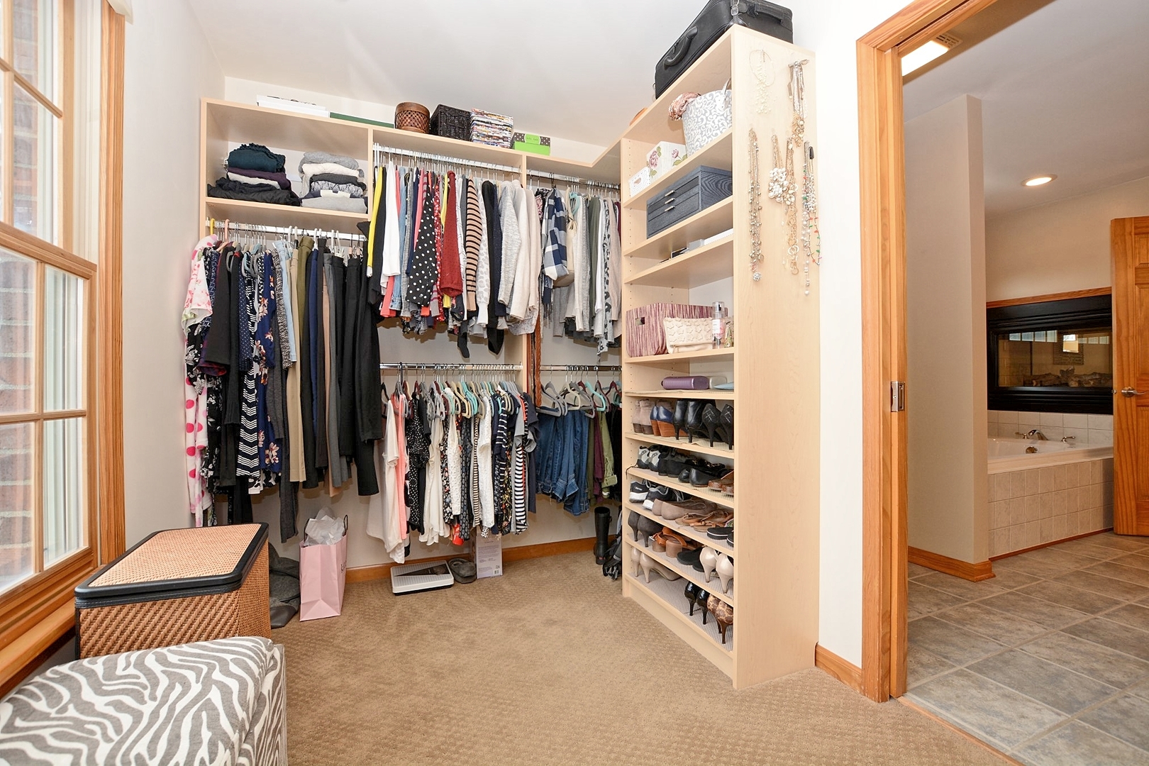916 Merrill New Road Sugar Grove, IL 60554 - Photo 16 of 23 a view of walk in closet with clothes and shoes
