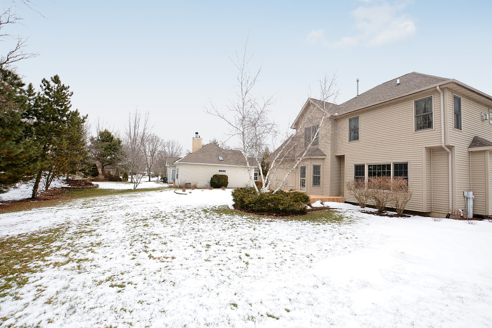 916 Merrill New Road Sugar Grove, IL 60554 - Photo 3 of 23 a view of white house with a yard covered in snow