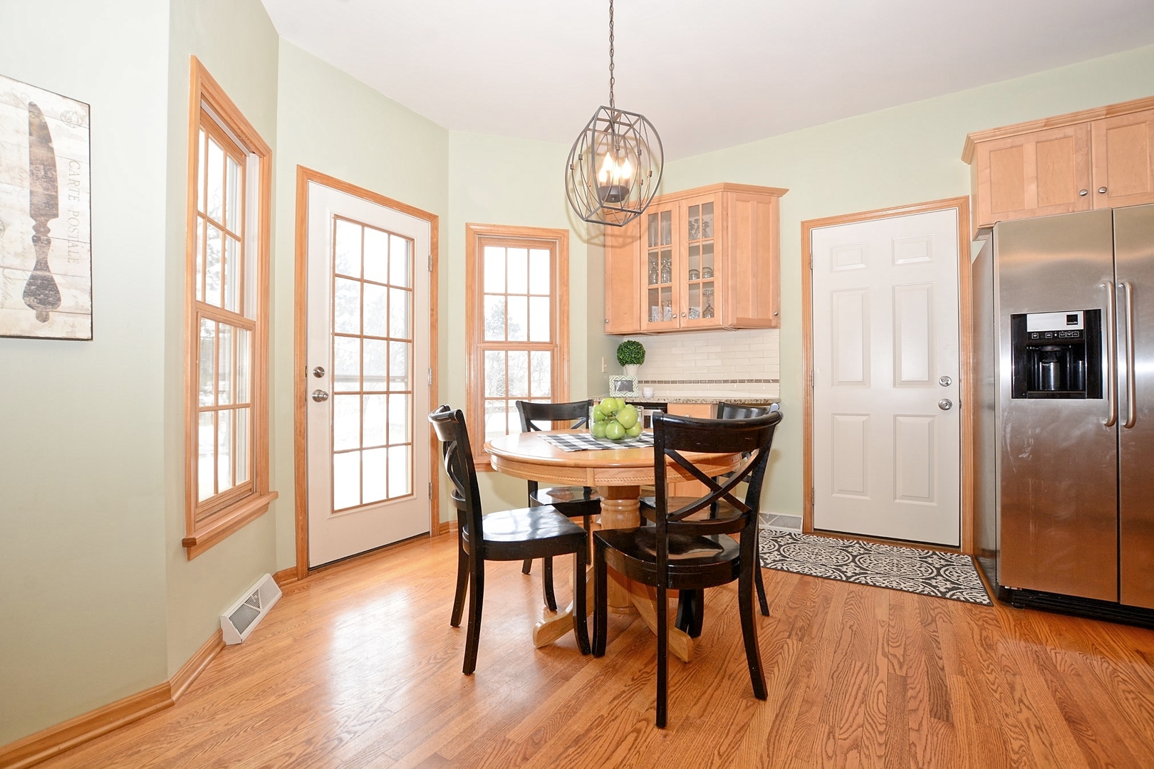 916 Merrill New Road Sugar Grove, IL 60554 - Photo 6 of 23 a view of a dining room with furniture window and wooden floor