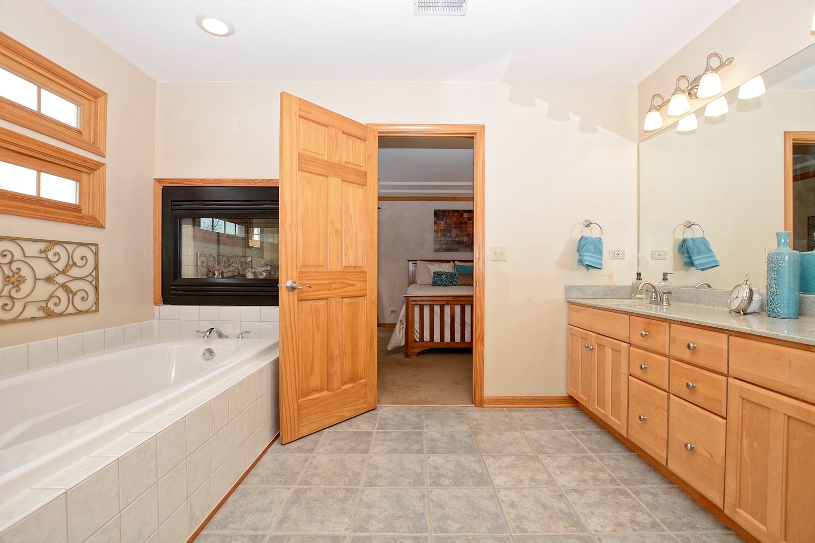 916 Merrill New Road Sugar Grove, IL 60554 - Photo 7 of 23 a spacious bathroom with a tub sink and mirror