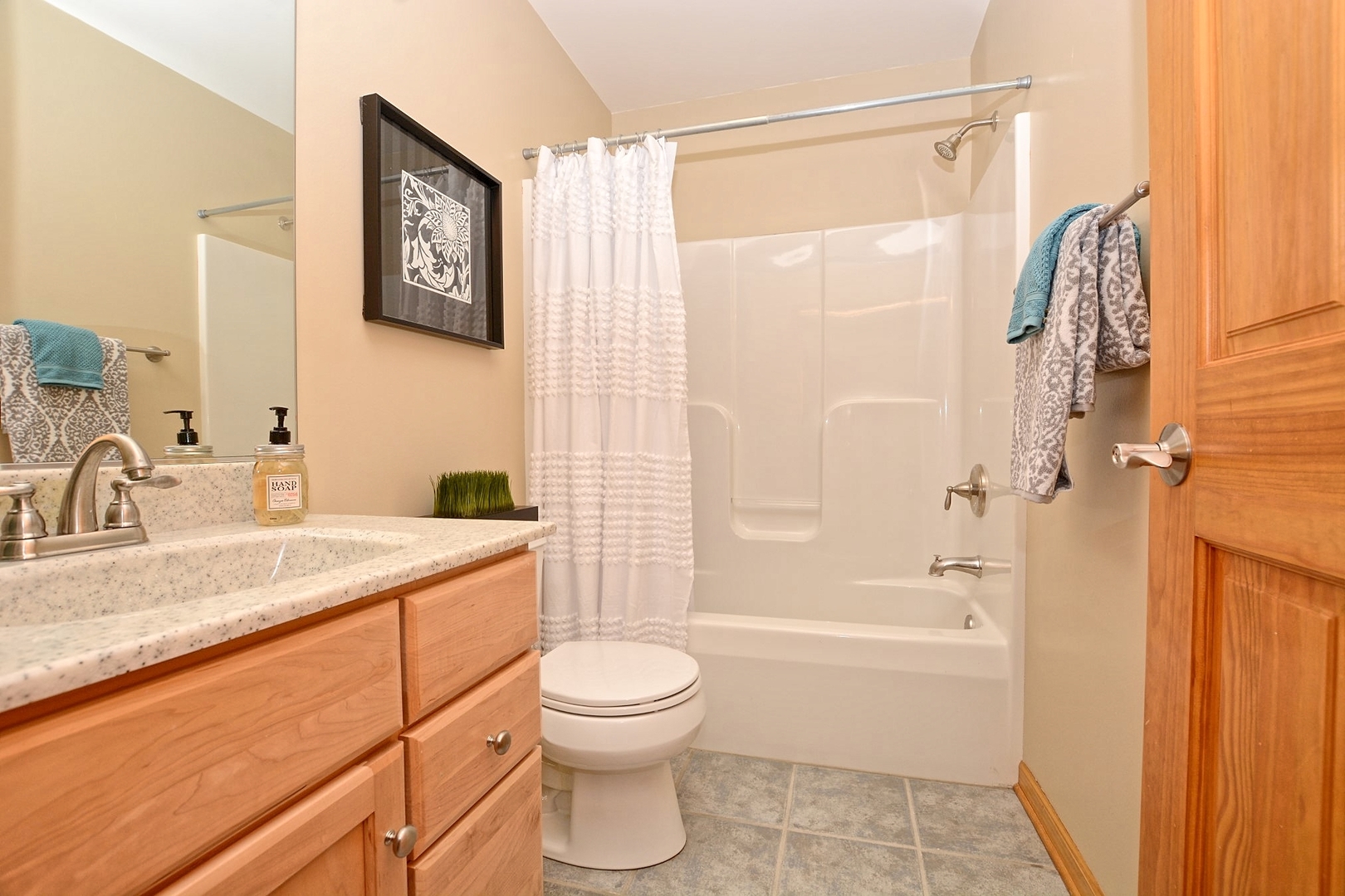 916 Merrill New Road Sugar Grove, IL 60554 - Photo 8 of 23 a bathroom with a granite countertop sink a toilet and shower
