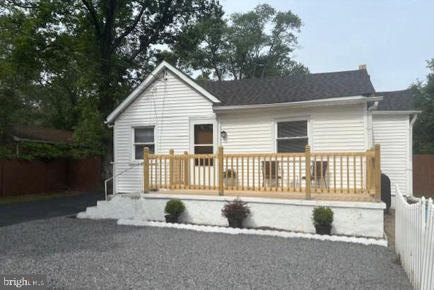 a house that has a tree in front of it