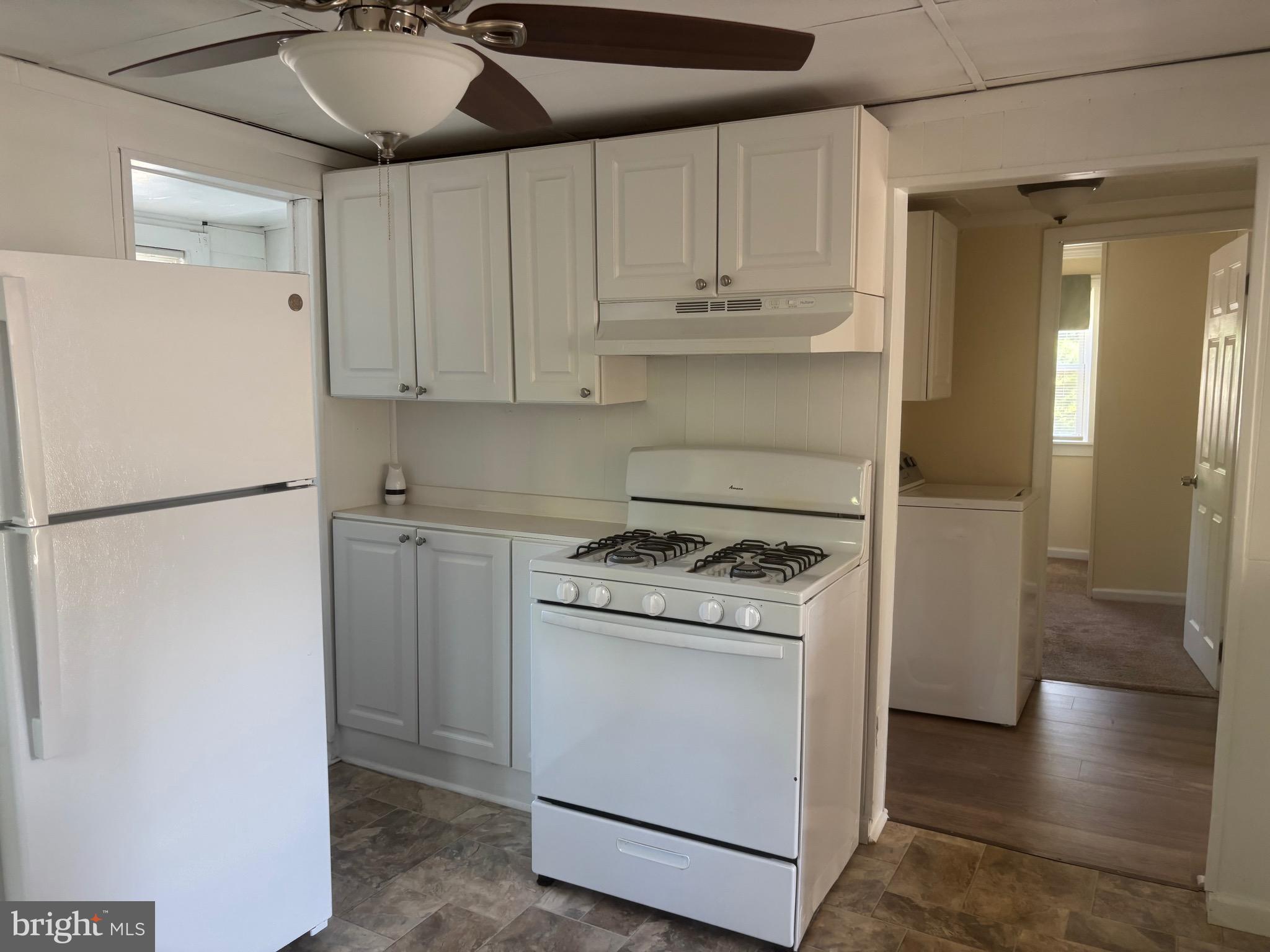 1601 Highway 206 Tabernacle, NJ 08088 - Photo 5 of 12 a kitchen with stainless steel appliances granite countertop a refrigerator a stove and white cabinets