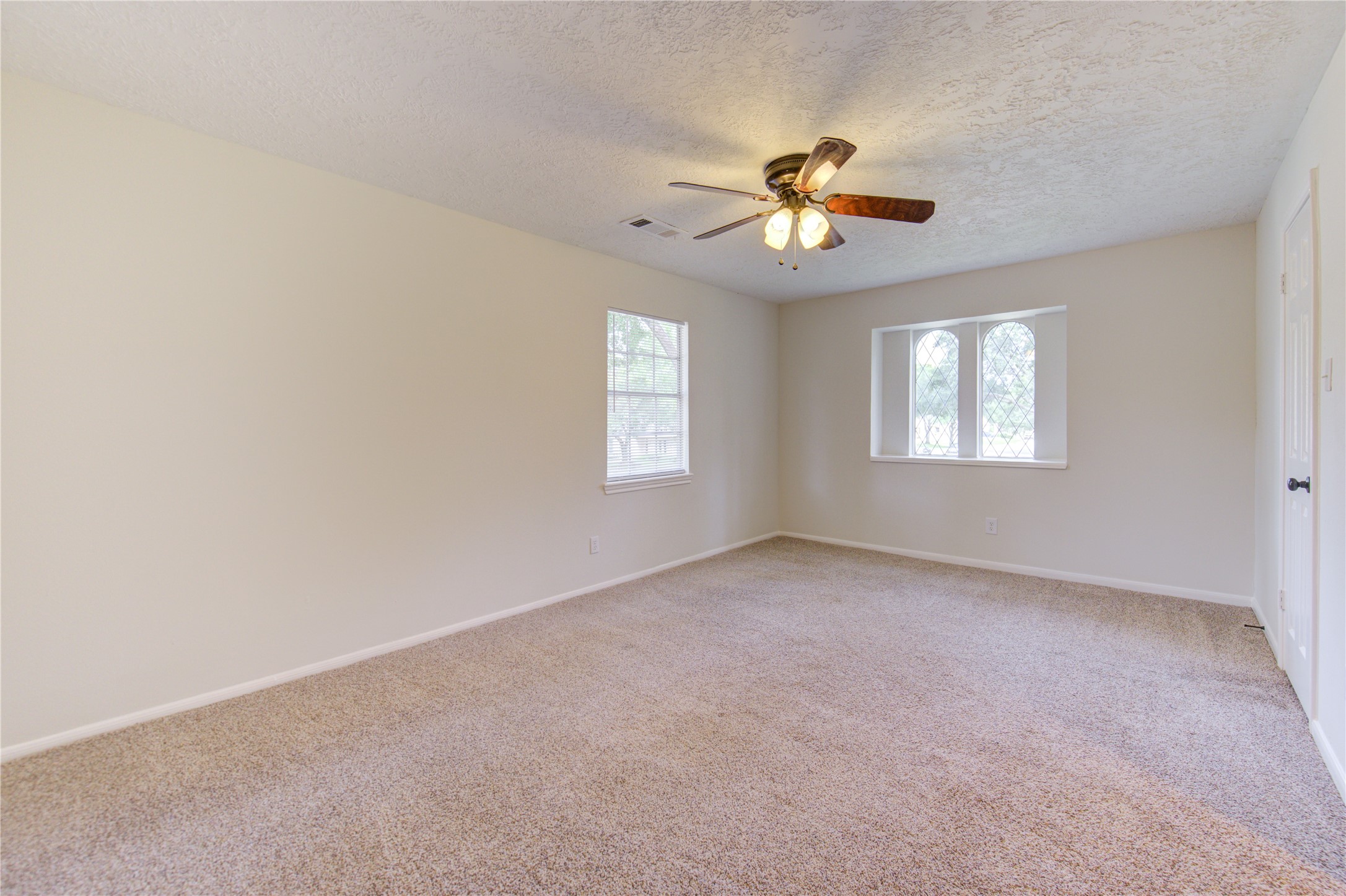 9115 Taidswood Drive Spring, TX 77379 - Photo 29 of 45 Bedroom 4 - All bedrooms have lighted ceiling fans, neutral paint and carpeting, and large walk-in closets!