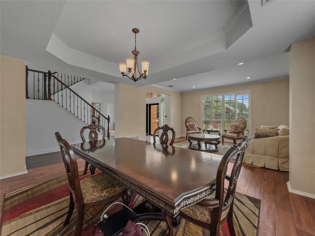 2317 Wellesly Road Rowlett, TX 75089 - Photo 14 of 39 a view of a dining room with furniture window and wooden floor