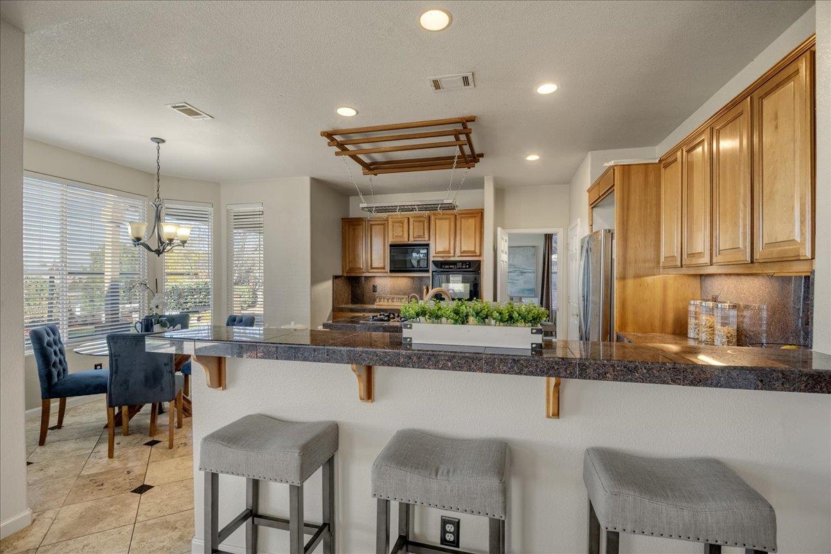 6315 Skywalker Drive San Jose, CA 95135 - Photo 11 of 34 a large kitchen with a table and chairs