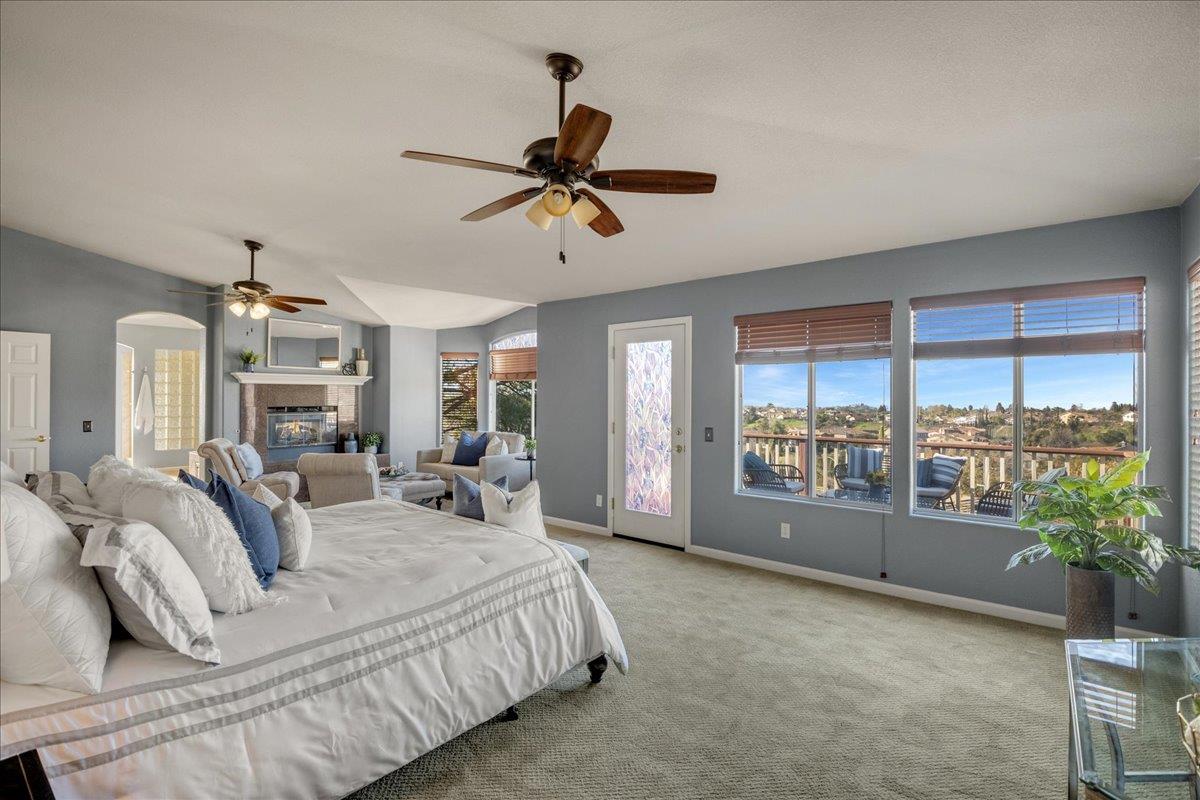 6315 Skywalker Drive San Jose, CA 95135 - Photo 16 of 34 a spacious bedroom with a large bed and a chandelier