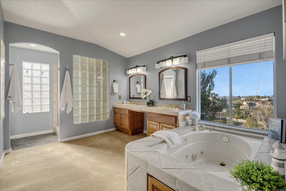 6315 Skywalker Drive San Jose, CA 95135 - Photo 19 of 34 a bathroom with a tub sink and mirror