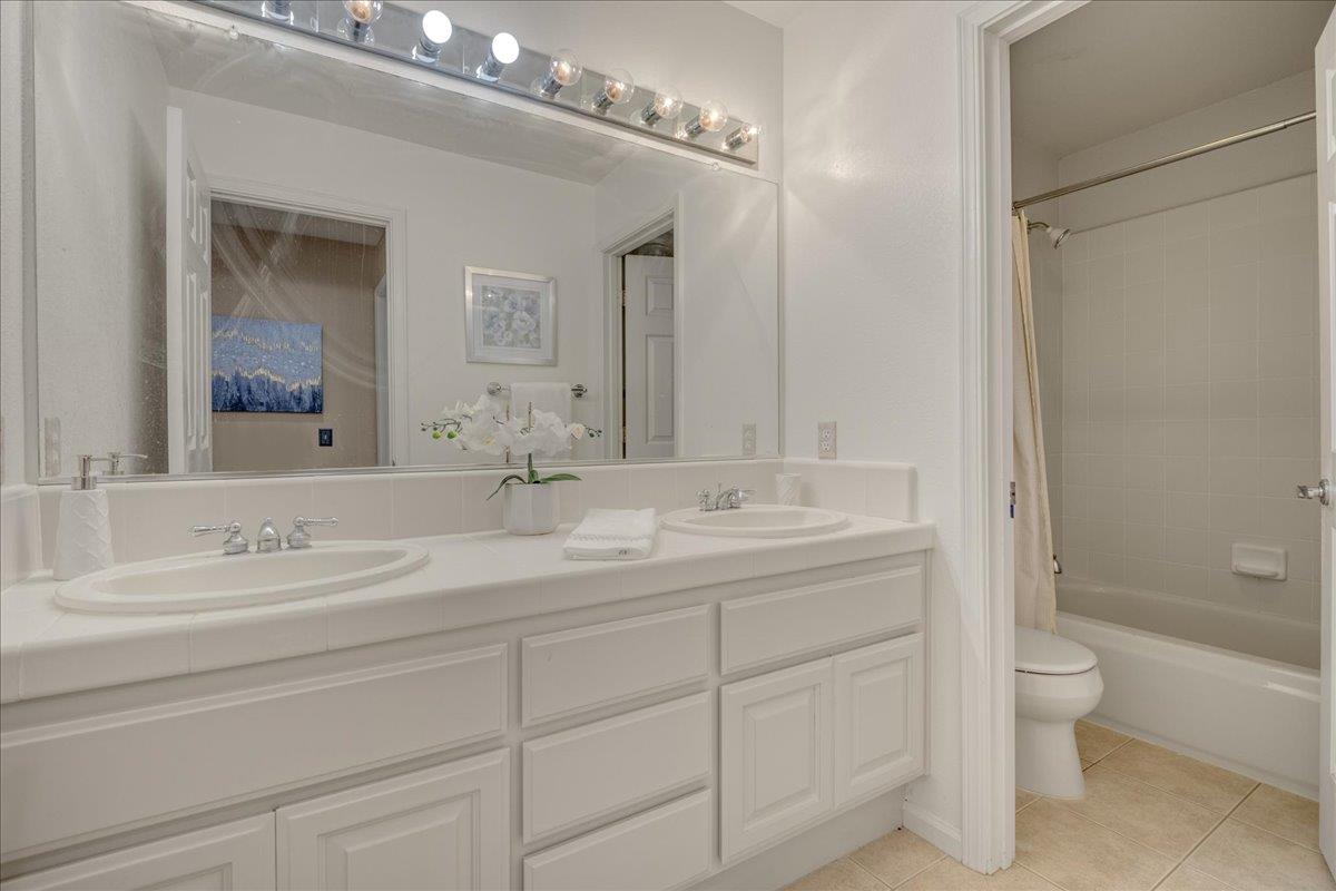 6315 Skywalker Drive San Jose, CA 95135 - Photo 24 of 34 a bathroom with a double vanity sink mirror double and a bathtub