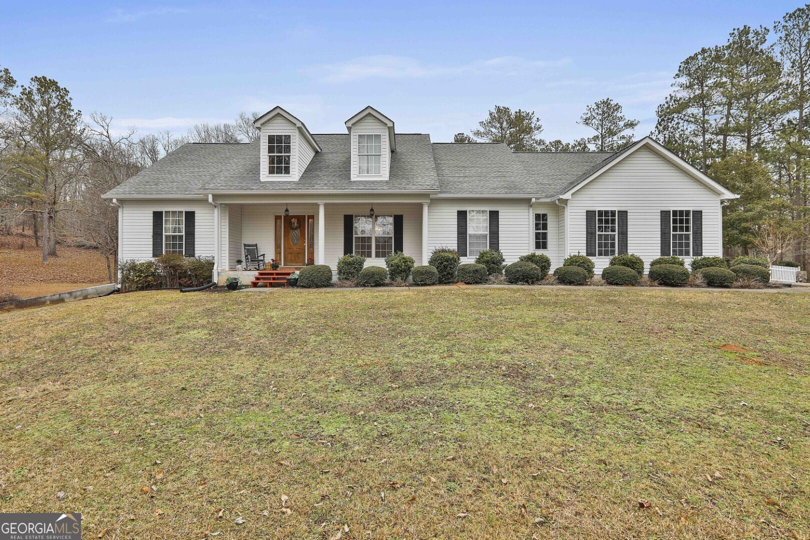 107 Burnham Road Newnan, GA 30263 - Photo 1 of 1 a front view of house with yard and trees around