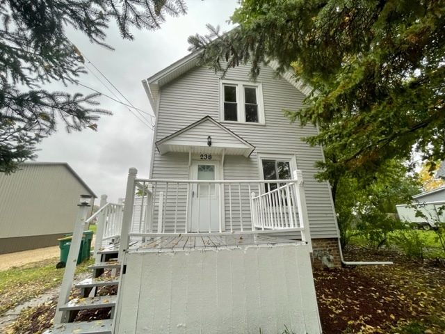 238 Lucas Street Sycamore, IL 60178 - Photo 1 of 28 a front view of a house with a yard