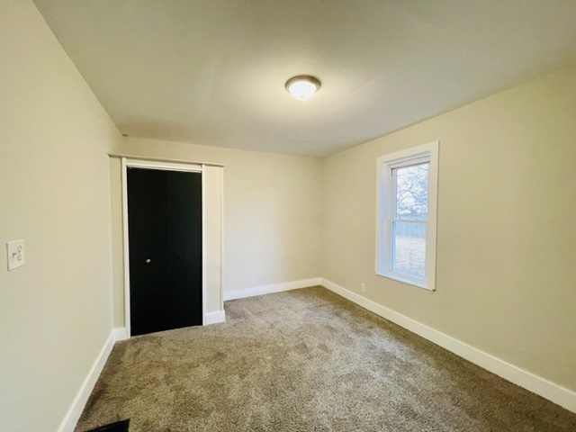 238 Lucas Street Sycamore, IL 60178 - Photo 25 of 28 an empty room with windows