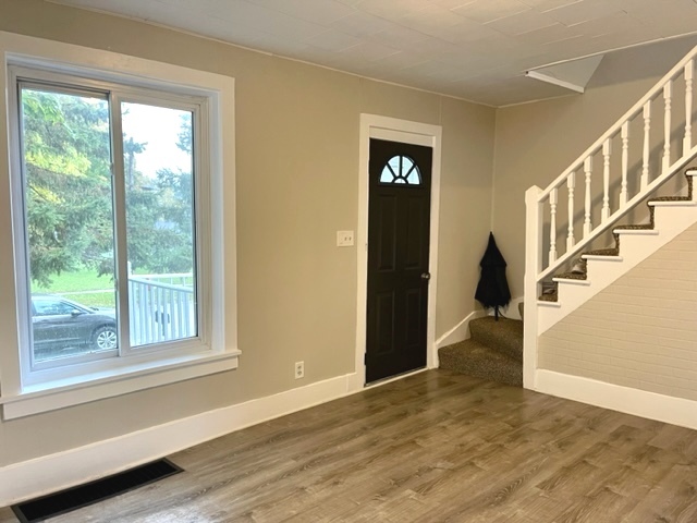 238 Lucas Street Sycamore, IL 60178 - Photo 4 of 28 a view of an entryway with wooden floor and windows
