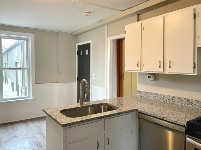 238 Lucas Street Sycamore, IL 60178 - Photo 6 of 28 a kitchen with a sink and cabinets