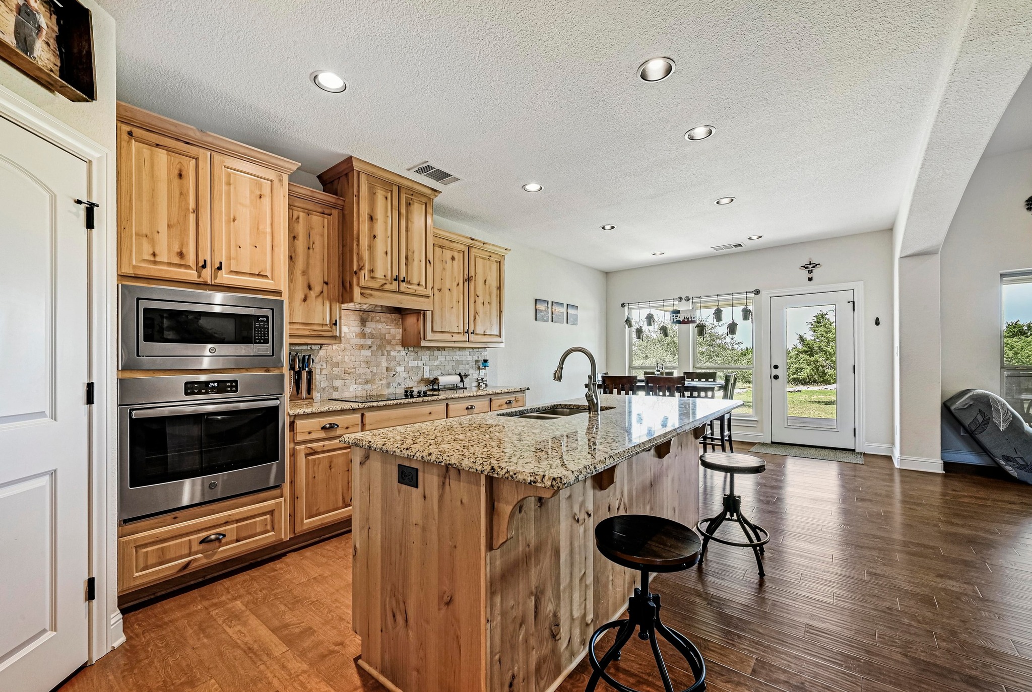 312 First Down Dash Burnet, TX 78611 - Photo 12 of 39 a kitchen with stainless steel appliances granite countertop a stove and a refrigerator