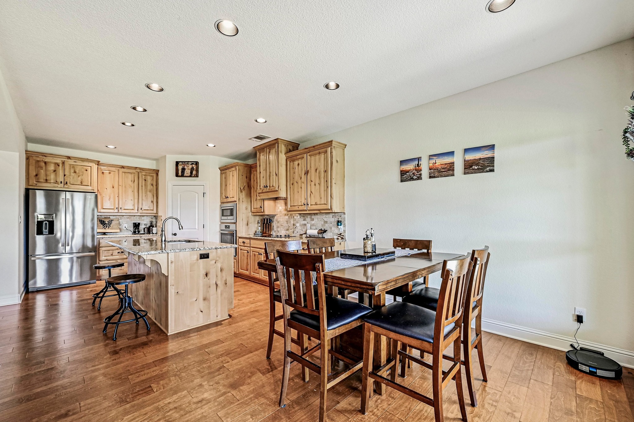 312 First Down Dash Burnet, TX 78611 - Photo 14 of 39 a view of a dining room with furniture and wooden floor
