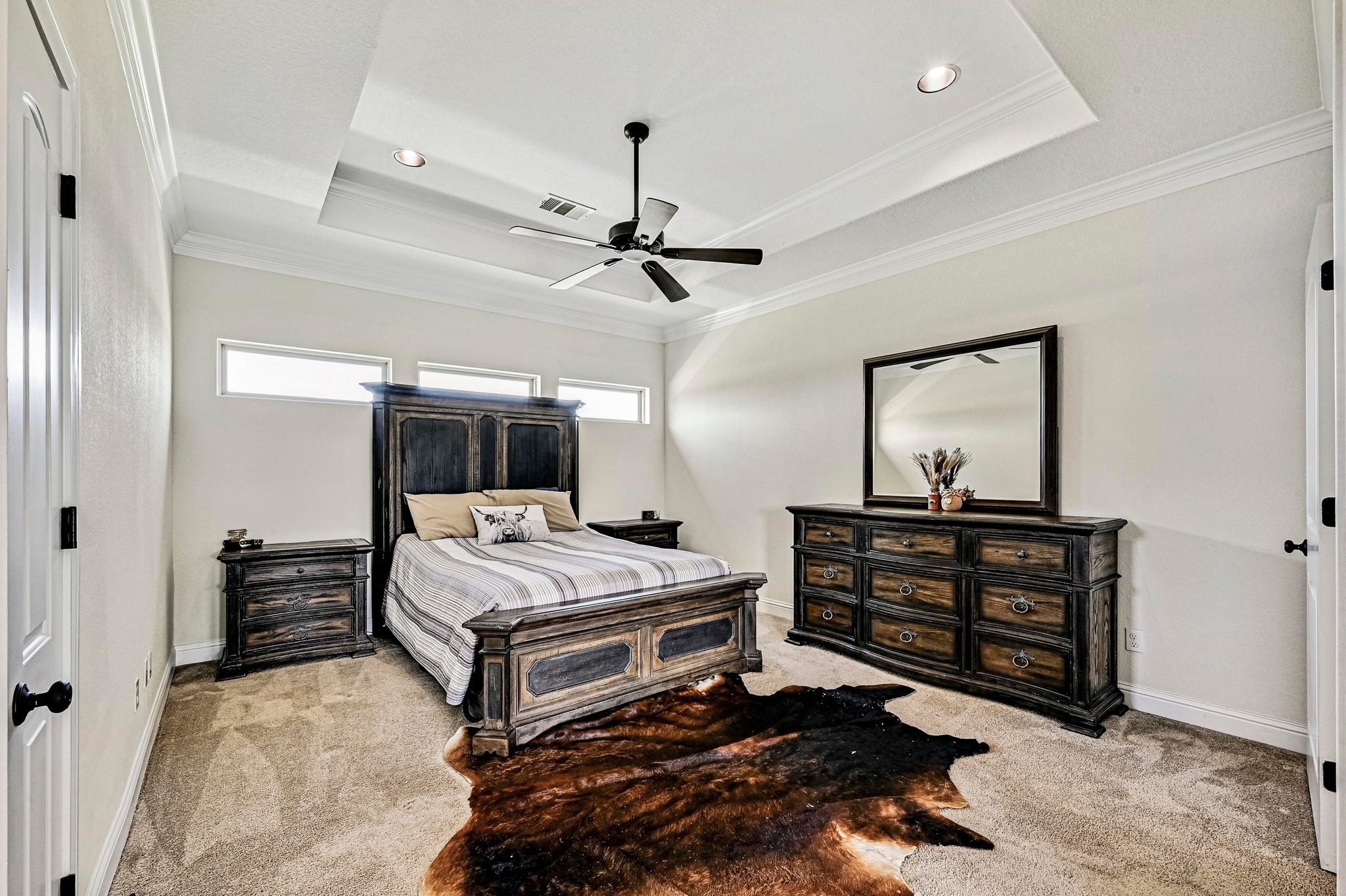 312 First Down Dash Burnet, TX 78611 - Photo 16 of 39 a bedroom with a bed and a chandelier