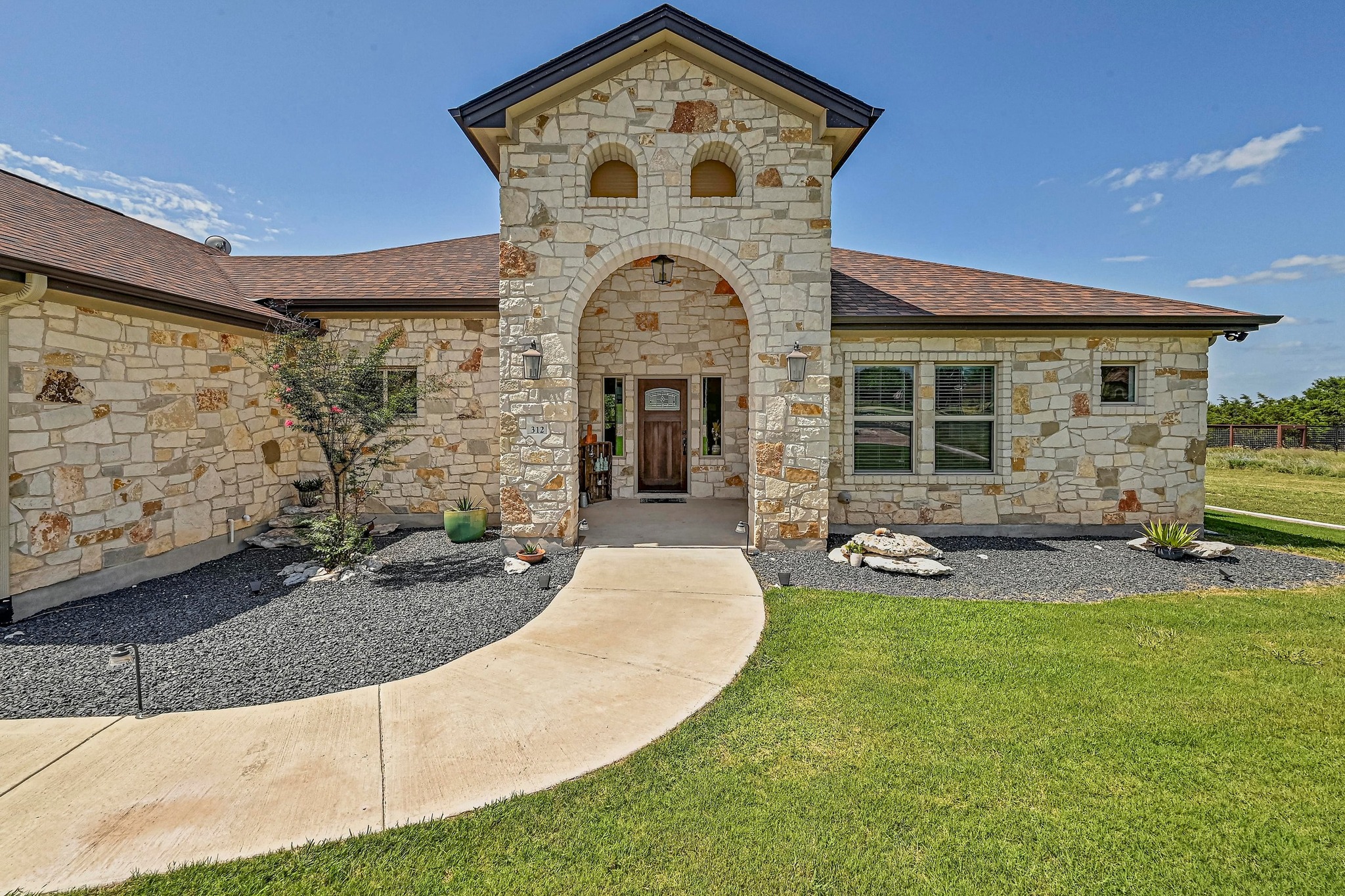 312 First Down Dash Burnet, TX 78611 - Photo 2 of 39 a front view of a house with patio