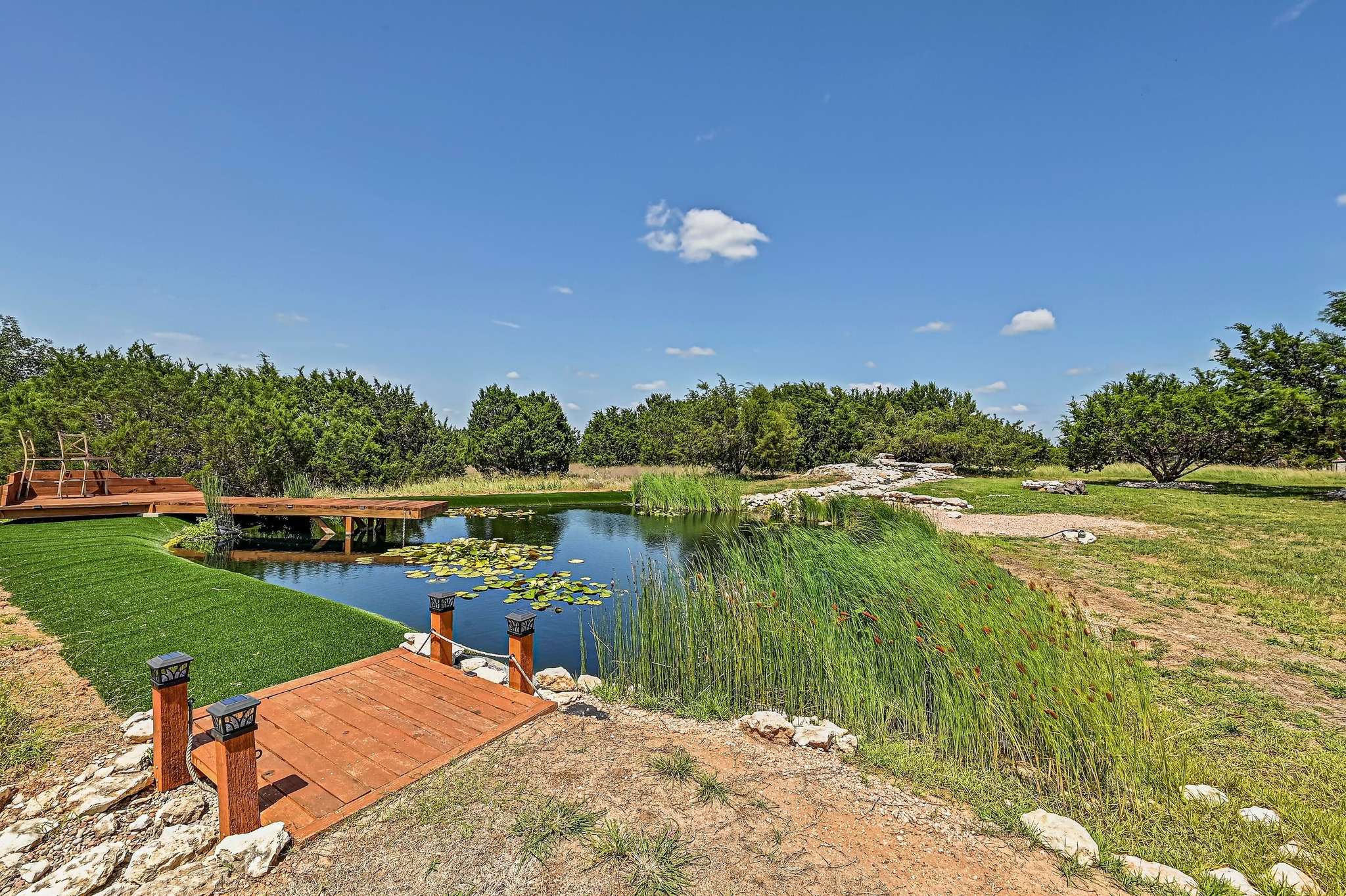 312 First Down Dash Burnet, TX 78611 - Photo 33 of 39 a view of a lake with a yard