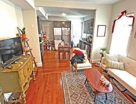 25-27 Marney Street Cambridge, MA 02141 - Photo 11 of 21 a living room with furniture and a wooden floor