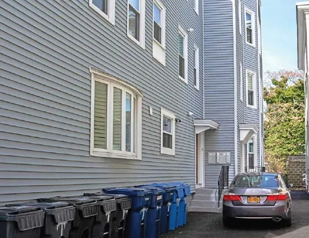 a car parked in front of a house