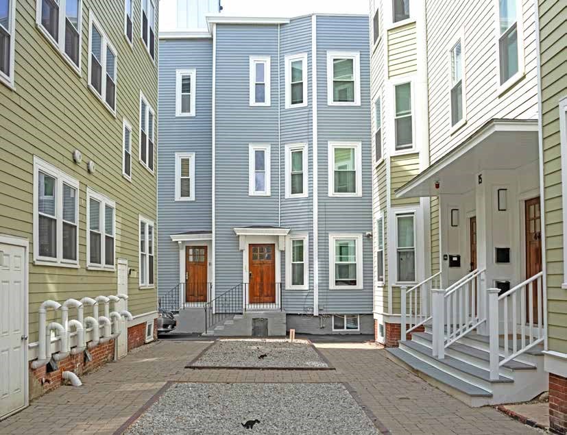 25-27 Marney Street Cambridge, MA 02141 - Photo 4 of 21 a front view of a brick building with many windows