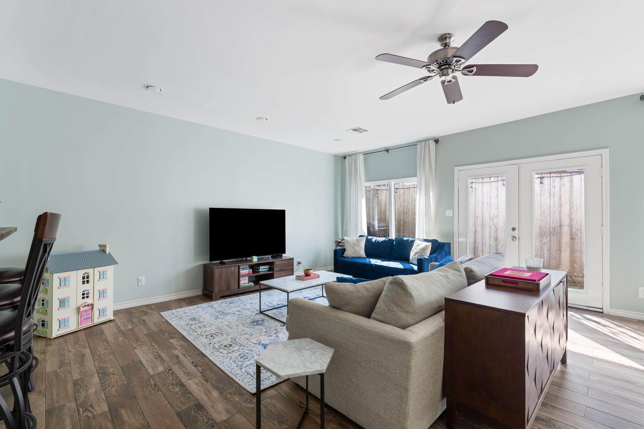 2612 Yupon Street Houston, TX 77006 - Photo 16 of 40 Doors open to the turf backyard, a rare private outdoor feature in Montrose townhome living.