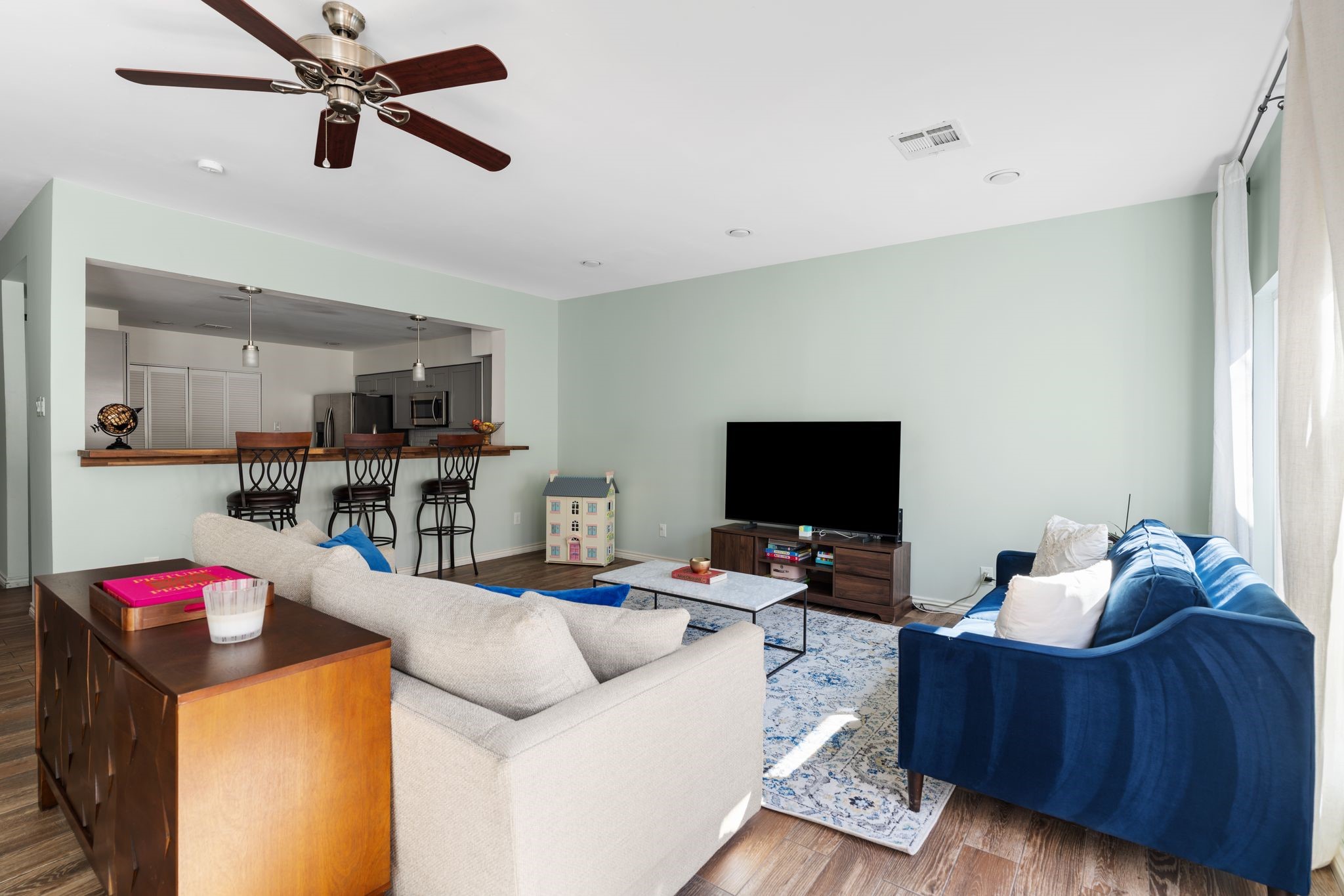 2612 Yupon Street Houston, TX 77006 - Photo 18 of 40 Another perspective of the open living space showcases clean finishes, bright walls, and easy access to the private backyard retreat.