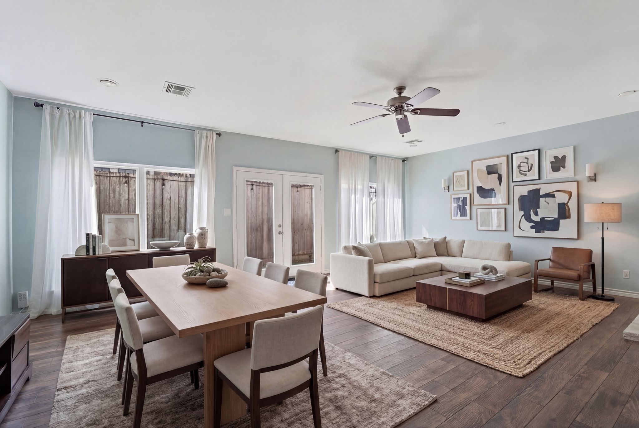 2612 Yupon Street Houston, TX 77006 - Photo 2 of 41 a living room with furniture a table and wooden floor