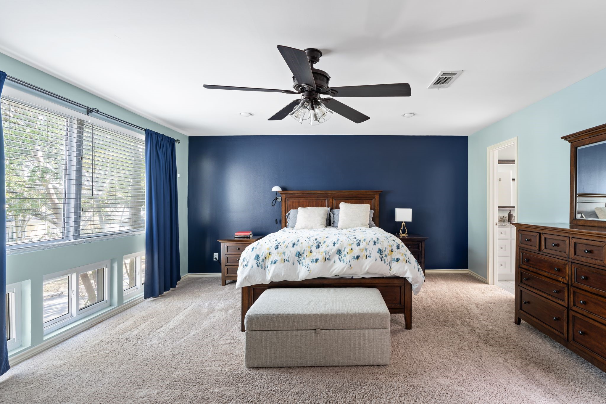 2612 Yupon Street Houston, TX 77006 - Photo 23 of 40 Another view of the primary suite highlights the private entrance to the ensuite bathroom and bright eastern exposure.