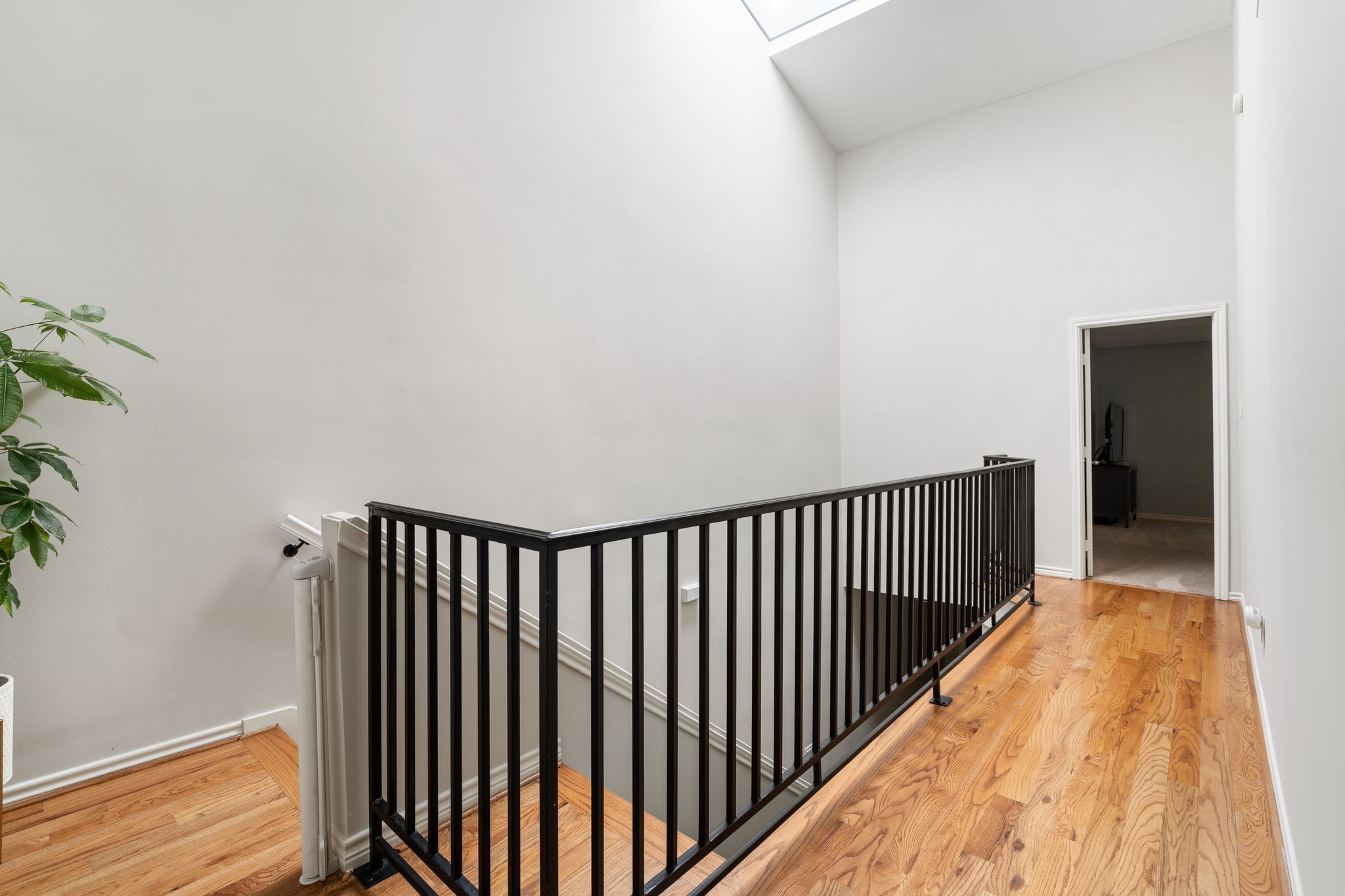 2612 Yupon Street Houston, TX 77006 - Photo 27 of 40 Second floor landing is filled with natural light from the overhead skylight and offers an open connection between bedrooms.