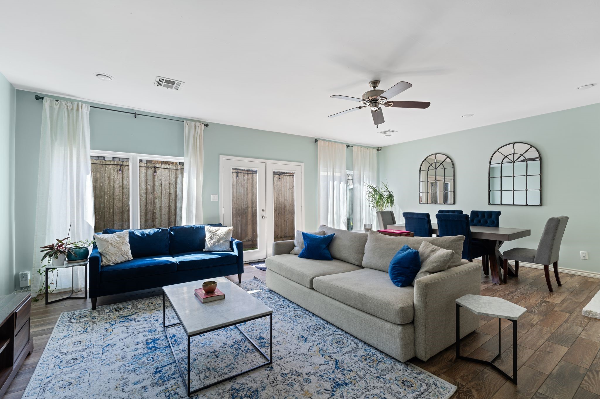 2612 Yupon Street Houston, TX 77006 - Photo 5 of 40 Spacious open concept living and dining area with backyard views creates a flexible layout that flows easily for everyday living and hosting.