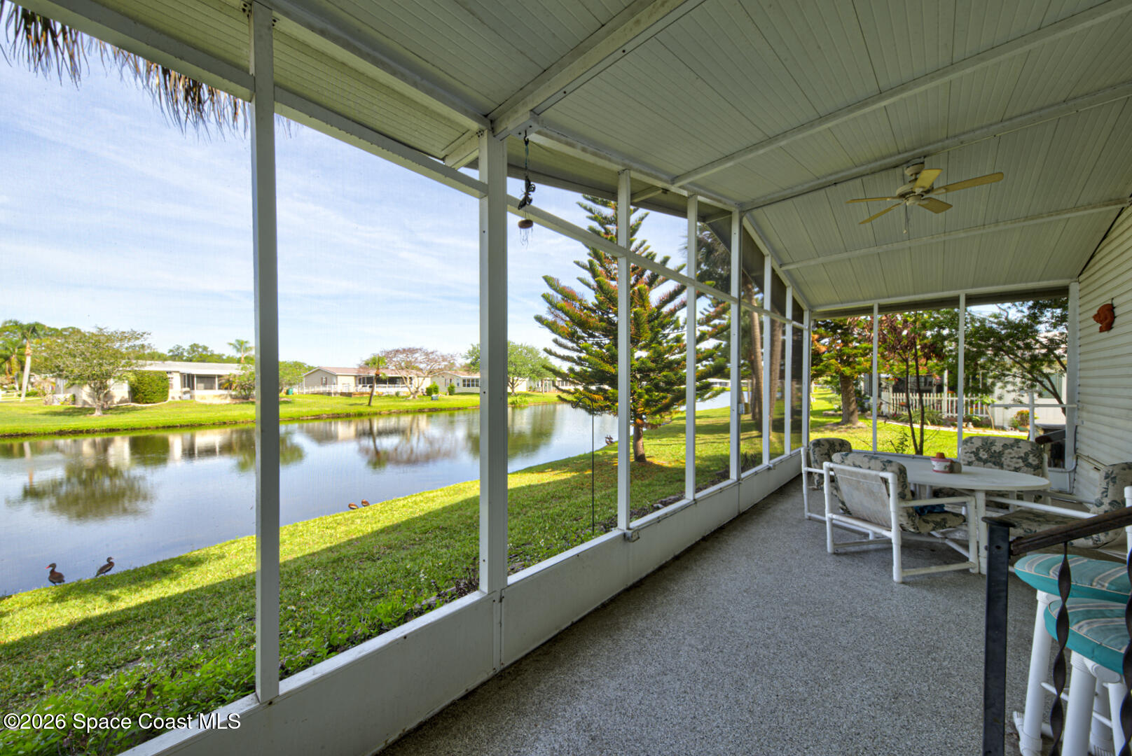 176 Woodsmill Boulevard, Unit 177 Cocoa, FL 32926 - Photo 50 of 63 48 screened in back porch