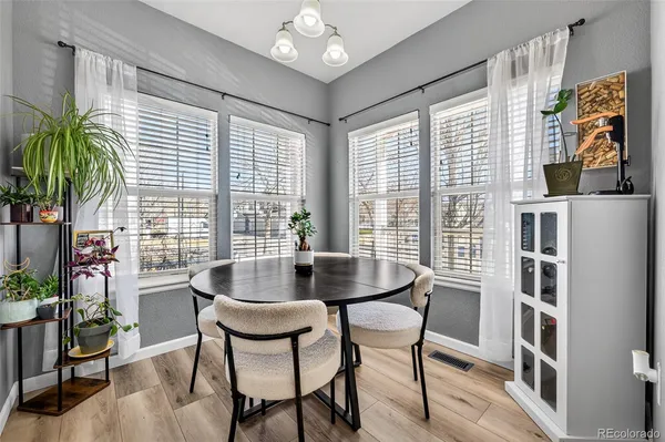a dining room with furniture and window