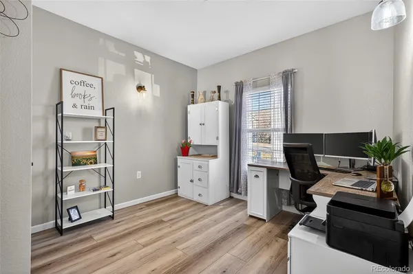 a room with furniture and a wooden floor