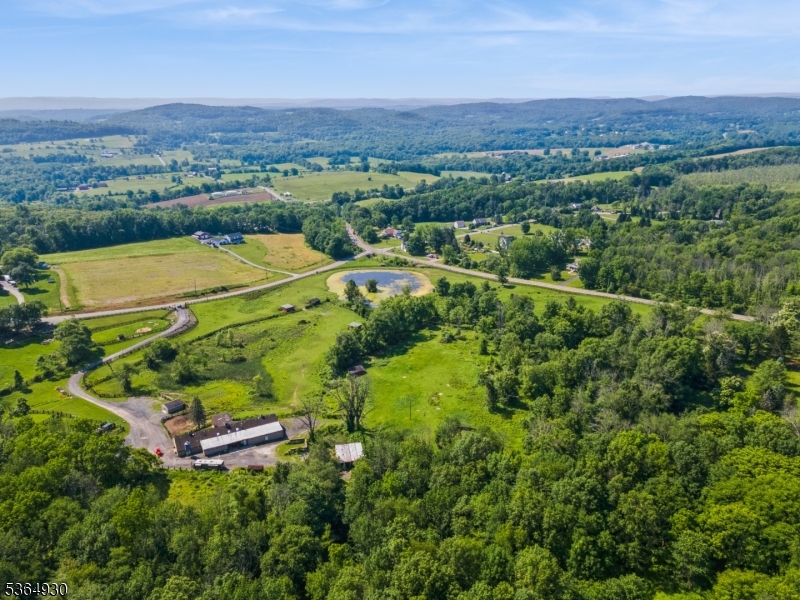 10 Pidgeon Hill Road Wantage, NJ 07461 - Photo 20 of 45 an aerial view of a houses with a lush green hillside