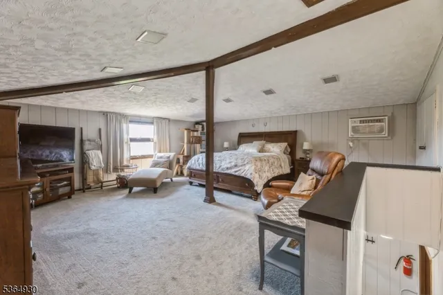 a bedroom with a bed a desk and chair