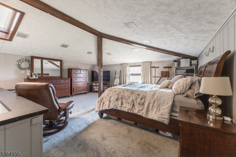 10 Pidgeon Hill Road Wantage, NJ 07461 - Photo 27 of 45 a bedroom with a bed a desk and chair