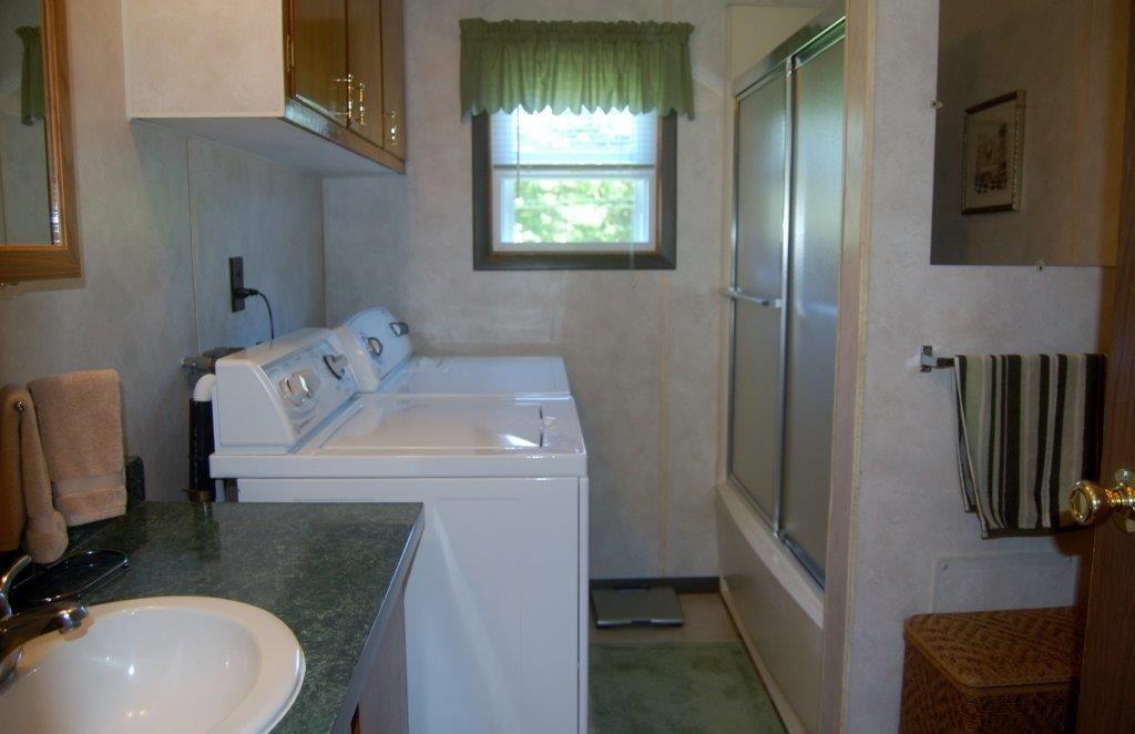 35 Cottle Road Oakland, ME 04963 - Photo 13 of 24 MASTER BATHROOM AND LAUNDRY