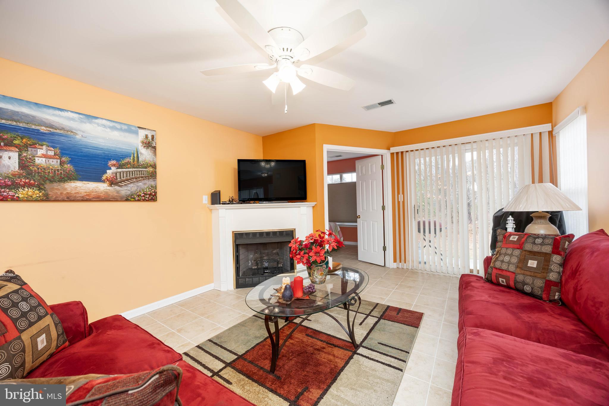 11427 Manklin Creek Road, Unit 7 Ocean Pines, MD 21811 - Photo 16 of 42 a living room with furniture and a flat screen tv