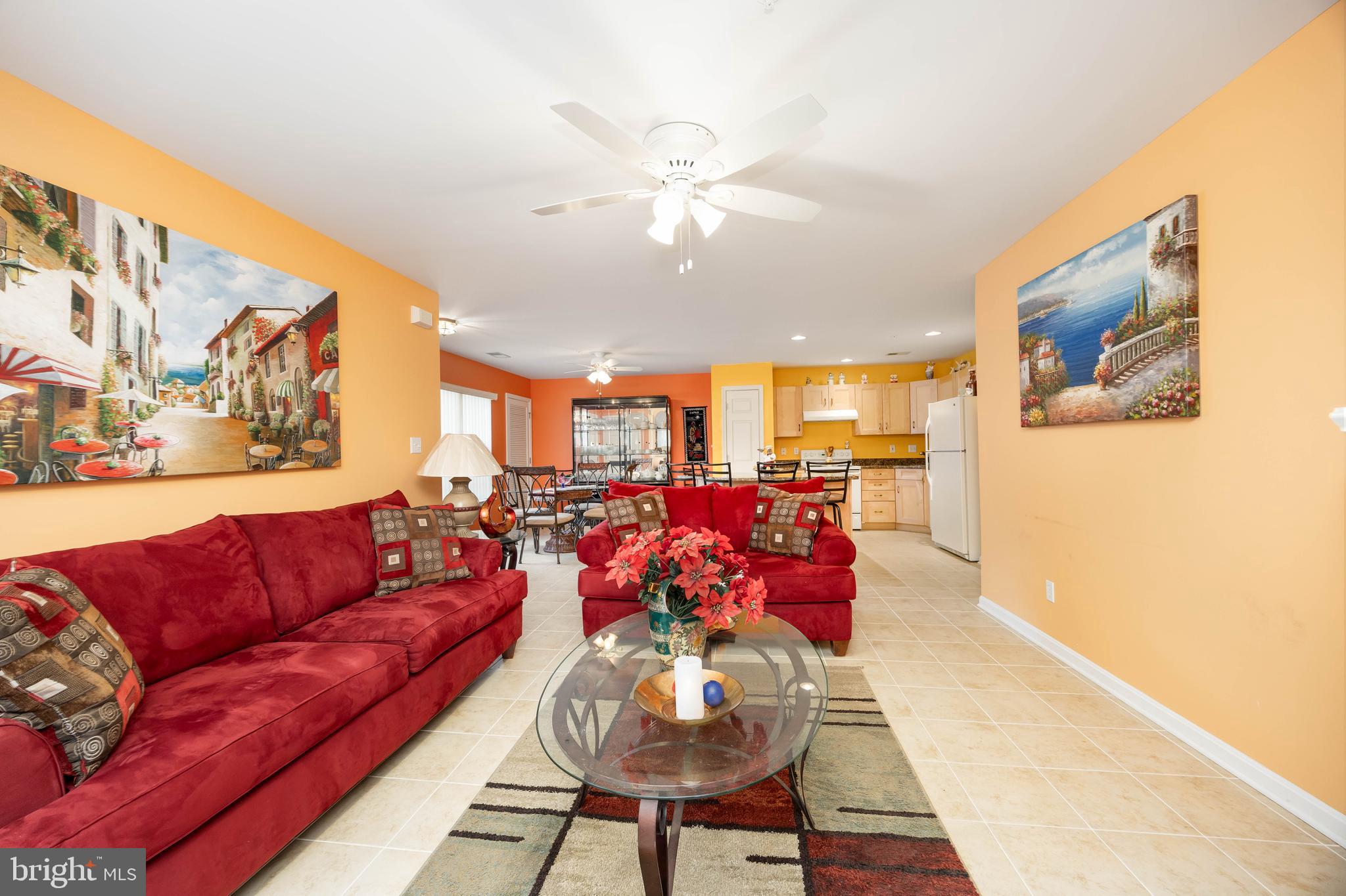 11427 Manklin Creek Road, Unit 7 Ocean Pines, MD 21811 - Photo 18 of 42 a living room with furniture kitchen and a chandelier