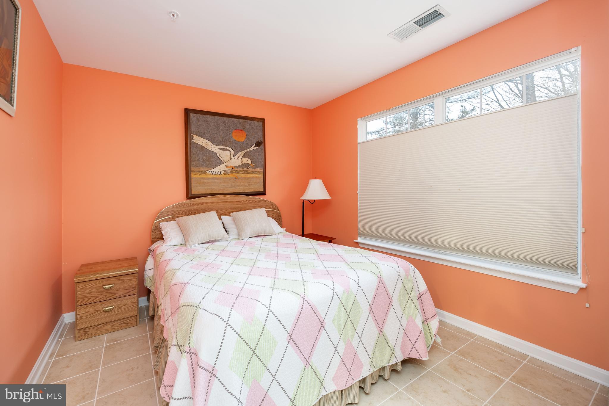 11427 Manklin Creek Road, Unit 7 Ocean Pines, MD 21811 - Photo 20 of 42 a bedroom with a bed and window