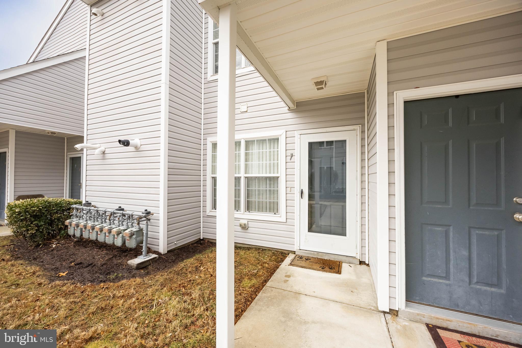 11427 Manklin Creek Road, Unit 7 Ocean Pines, MD 21811 - Photo 2 of 42 a house with a outdoor space
