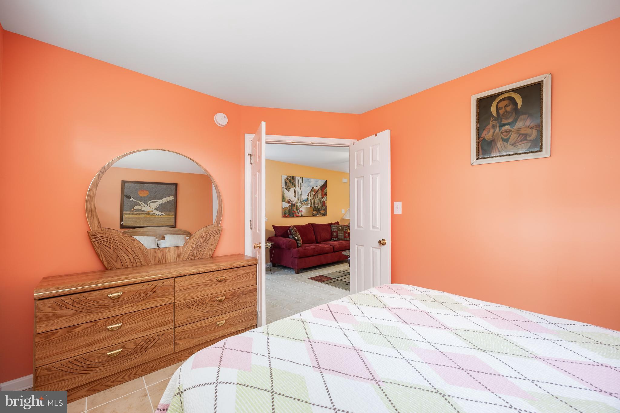 11427 Manklin Creek Road, Unit 7 Ocean Pines, MD 21811 - Photo 22 of 42 a bedroom with a bed and a dresser